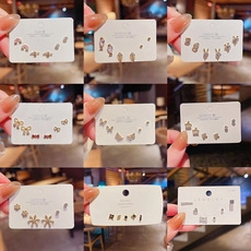 Set detallado de pendientes de plata S925 con diseños que incluyen estrellas y luna