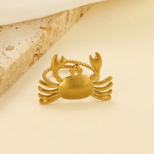 Golden crab-shaped stainless steel open ring with textured band from a 45-degree angle