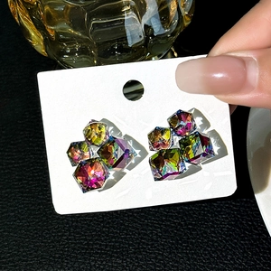 Luxury geometric cube stud earrings with aurora crystal cubes on a display card