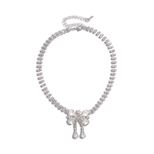 Silver bow necklace with crystal teardrop tassel and double-row diamond chain link