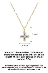 Detailed view of gold clover pendant with crystals and 40cm stainless steel chain