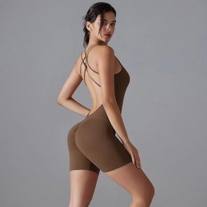 Detail of cross-back straps and open back design on a coffee yoga bodysuit