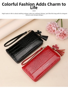 Detail showing red and black crocodile textured long wallets with tassel floral charms