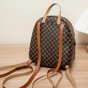 Deep brown small backpack for women featuring vintage geometric patterns and iron decor