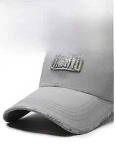 Detail of grey quick-dry sports cap featuring GRAND embroidery and RSPORT brim text