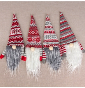 Detailed view of four Christmas gnome bottle covers with knitted hats and plush beards