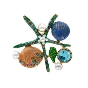 Enamel starfish and shell brooch with pearls and colorful gems on a white background