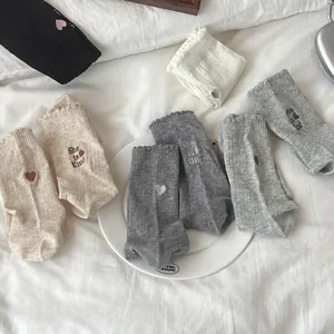 Women's mesh mid-calf socks set with heart embroidery and stylish ruffled cuffs