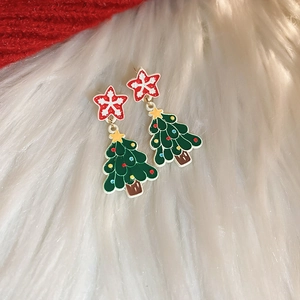 Detail of green Christmas tree earrings with colorful dots and silver needle base