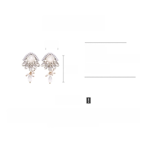 Detailed view of resin faux pearl drop earrings showing 5.5cm height and 3.5cm width dimensions