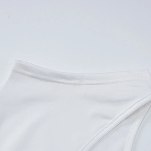 Detailed macro view showing the precise double-needle stitching on white dress neckline
