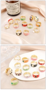 Macro shot of vintage style metal rings featuring colorful enamel and evil eye designs