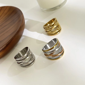 Three minimalist stainless steel layered rings in gold and silver for women