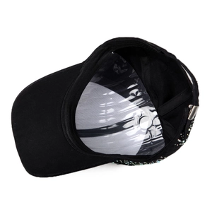 Detail view of cotton baseball cap interior featuring a metal adjustable buckle and rhinestones