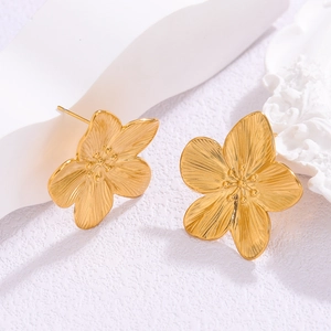 French vintage 18k gold plated floral stud earrings with radial brushed metal texture