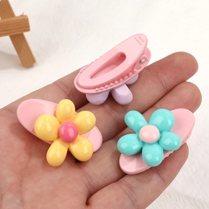 Three sweet floral duckbill hair clips for girls in pink, yellow and blue-green colors