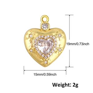Macro detail of gold plated heart pendant with crystals measuring 19mm by 15mm