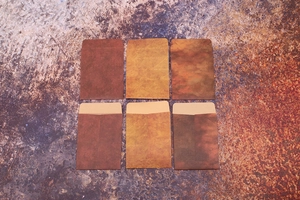 Flat lay of vintage style brown kraft paper envelopes in various earth tones and textures