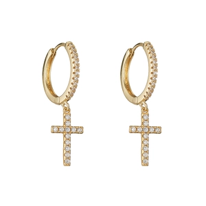Close-up of gold-plated hoop earrings with sparkling zircon-set cross pendants