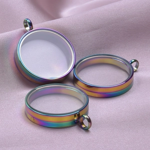 Rainbow stainless steel round glass locket pendants on elegant pink silk fabric