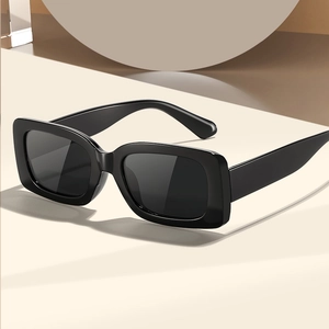 Classic black rectangular chunky frame sunglasses with dark lenses in a 45-degree angle view