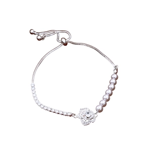 French zircon pearl bracelet featuring a diamond-encrusted rose pendant and adjustable clasp