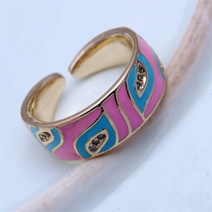 Detail of bohemian gold adjustable ring with pink blue enamel and small zircons