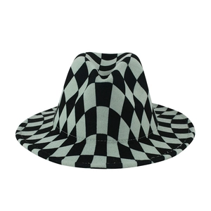 British style wide brim fedora hat with distorted black and white checkerboard felt pattern