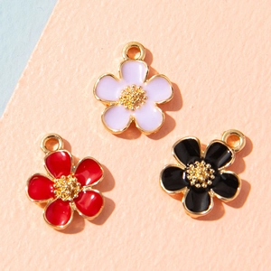 Three colorful enamel flower pendants in purple red and black for DIY jewelry making