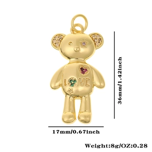 Detailed view of a gold bear pendant with colorful stones, LOVE engraving, and 36mm size