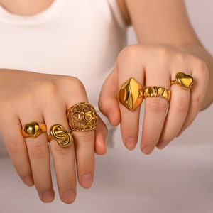 Set of 18K gold plated stainless steel rings featuring heart and geometric designs