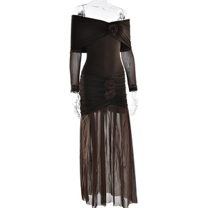 Detailed view of brown off-shoulder dress with mesh sleeves and floral waist accents
