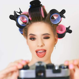 Close-up of professional hair rollers and clips used for salon styling and perming hair