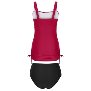 Detail of burgundy tankini top with white scalloped trim and black high-waisted bottoms