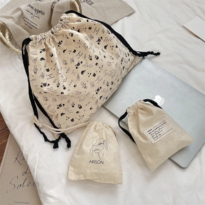 Three-piece set of cartoon cotton drawstring storage bags in various sizes for travel