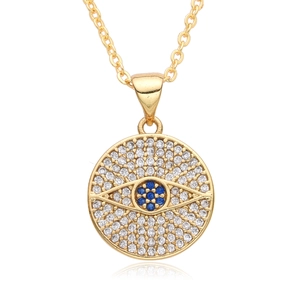 Detailed view of the gold Evil Eye pendant with blue and white zircon micro-pave setting
