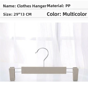 Detail view of adjustable non-slip plastic pants hanger with 29x13cm size specifications