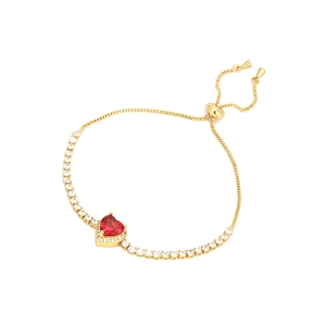 Gold-plated heart bracelet with ruby-red stone and white zircons on a white background