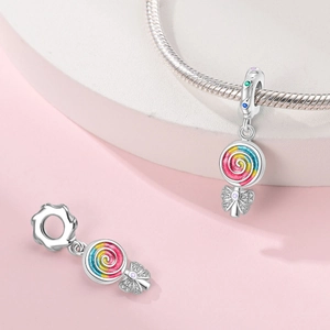 Detailed macro shot of colorful lollipop charms with enamel swirls and cubic zirconia