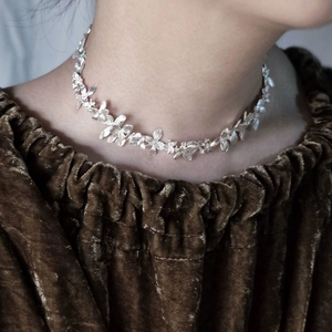 Handcrafted silver floral choker necklace for men and women featuring adjustable flower petals