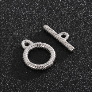 Macro shot of silver stainless steel OT clasp with twisted rope texture for jewelry