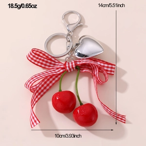 Detail view of cherry bow keychain with dimensions 14cm height and 18.5g weight
