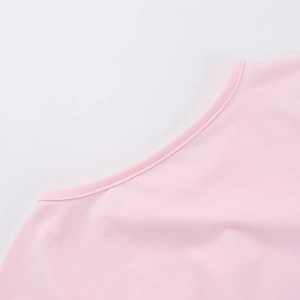 Detailed close-up of pink knit dress neckline with precision stitching and soft texture