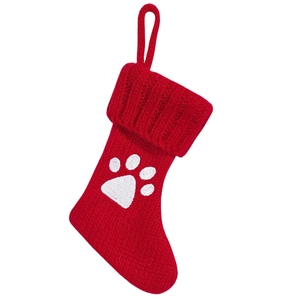 Red knitted Christmas stocking with white dog paw print and hanging loop decoration