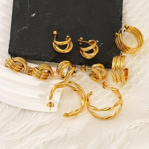 Golden double-layer C-shaped stainless steel earrings with twisted rope texture details