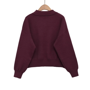 Burgundy loose-fit knitted sweater with polo collar and ribbed cuffs in back view