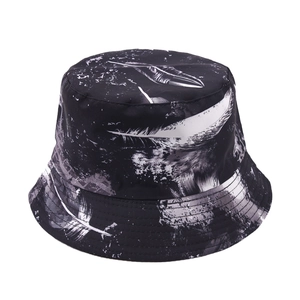 Detail of white feather print and reinforced stitching on a black bucket hat