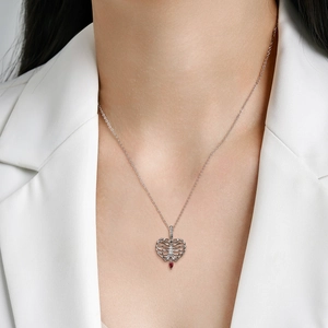 S925 sterling silver skeleton heart necklace with a red teardrop gemstone pendant