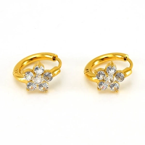 Detail view of gold flower earrings featuring clear zircon stones and a hoop clasp