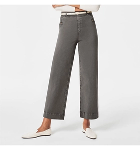 Detail view of grey high-waisted wide-leg trousers with fine stitching and white belt